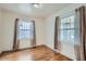 Well-lit bedroom with hardwood floors and ample window light at 3637 Lowell Blvd, Denver, CO 80211