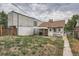 Backyard view showing a home with modern addition at 3637 Lowell Blvd, Denver, CO 80211