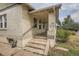 Side view of a charming bungalow with a covered porch at 3637 Lowell Blvd, Denver, CO 80211