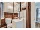 Clean bathroom with wood-paneled walls and a vanity at 3637 Lowell Blvd, Denver, CO 80211