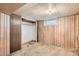 Unfinished basement room with closet and wood paneling at 3637 Lowell Blvd, Denver, CO 80211