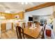 Dining area adjacent to kitchen with view into living room at 11987 E Harvard Ave # 101, Aurora, CO 80014