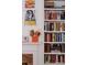 Well-stocked bookshelves display a collection of books and artwork at 836 E 17Th Ave # 2E, Denver, CO 80218