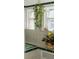 Spa-like bathroom with plants, a soaking tub, and green tile at 836 E 17Th Ave # 2E, Denver, CO 80218