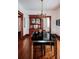 Bright dining room featuring a modern table, a vintage hutch, and hardwood floors at 836 E 17Th Ave # 2E, Denver, CO 80218