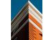 Close-up of building's corner, showcasing intricate brickwork and crown molding at 836 E 17Th Ave # 2E, Denver, CO 80218