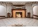 Elegant lobby with ornate fireplace, tile floor, and antique chairs at 836 E 17Th Ave # 2E, Denver, CO 80218