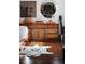 Serene bedroom with a large dresser, hardwood floors, and stylish mirrors at 836 E 17Th Ave # 2E, Denver, CO 80218