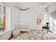 Bright Bedroom with a crib, rug, and colorful decor at 836 E 17Th Ave # 2E, Denver, CO 80218