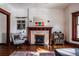 Living room with fireplace and hardwood floors at 836 E 17Th Ave # 2E, Denver, CO 80218