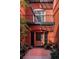 Elegant building entrance with a charming courtyard and potted plants at 836 E 17Th Ave # 2E, Denver, CO 80218