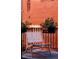 Relaxing balcony with a chair and potted plants, offering an urban retreat at 836 E 17Th Ave # 2E, Denver, CO 80218