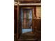 View of a historic wine cellar with wooden racks and a vintage bottle at 836 E 17Th Ave # 2E, Denver, CO 80218