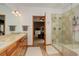 Elegant bathroom with dual sinks, a shower, and a soaking tub at 7747 S Settlers Dr, Morrison, CO 80465