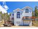 Two-story home with double garage and deck at 11770 Leavenworth Dr, Conifer, CO 80433