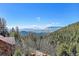Stunning mountain views from a deck at 11770 Leavenworth Dr, Conifer, CO 80433