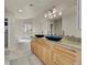 Elegant bathroom with double vanities, soaking tub, and marble flooring at 11770 Leavenworth Dr, Conifer, CO 80433