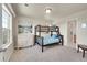 Bedroom with a bunk bed, dresser, and large window at 11770 Leavenworth Dr, Conifer, CO 80433