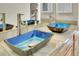 Bathroom with dual sinks, blue glass basins, and wood cabinets at 11770 Leavenworth Dr, Conifer, CO 80433