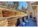 Private deck with mountain views and wooden retaining wall at 11770 Leavenworth Dr, Conifer, CO 80433