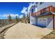 Large concrete driveway with mountain views and home access at 11770 Leavenworth Dr, Conifer, CO 80433