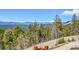 Panoramic mountain views with snow-capped peaks and a winding road below at 11770 Leavenworth Dr, Conifer, CO 80433