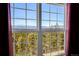Stunning mountain views seen from a large window at 11770 Leavenworth Dr, Conifer, CO 80433