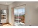 View from inside featuring sliding doors leading to a deck and mountain views at 11770 Leavenworth Dr, Conifer, CO 80433