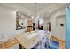 Spacious dining area with hardwood floors and wood table at 11770 Leavenworth Dr, Conifer, CO 80433