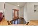 Bright entryway with hardwood floors and granite tile at 11770 Leavenworth Dr, Conifer, CO 80433