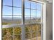 Stunning mountain views seen through a large window at 11770 Leavenworth Dr, Conifer, CO 80433