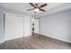 Bedroom with hardwood floors, ceiling fan and access to laundry at 5775 W Atlantic Pl # 303, Lakewood, CO 80227