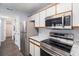 Kitchen with stainless steel appliances and granite countertops at 5775 W Atlantic Pl # 303, Lakewood, CO 80227