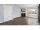 Living room with fireplace and hardwood floors at 5775 W Atlantic Pl # 303, Lakewood, CO 80227