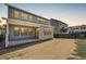 Two-story home with gray siding and a covered patio at 11077 Star Fall St, Littleton, CO 80125
