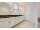 Modern bathroom with double vanity and dark countertop at 11077 Star Fall St, Littleton, CO 80125