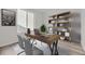 Modern home office with built-in shelving and a spacious desk at 11077 Star Fall St, Littleton, CO 80125