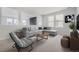 Bright and airy living room featuring a comfortable sectional sofa and stylish coffee table at 11077 Star Fall St, Littleton, CO 80125