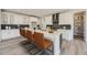 Modern kitchen with white cabinets, quartz countertops, and stainless steel appliances at 11077 Star Fall St, Littleton, CO 80125