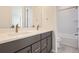 Elegant bathroom with a double vanity and a large mirror at 11077 Star Fall St, Littleton, CO 80125