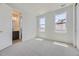 Well-lit bedroom with an en-suite bathroom and ample closet space at 11077 Star Fall St, Littleton, CO 80125