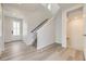 Light and spacious entryway with stairs and wood-look flooring at 11077 Star Fall St, Littleton, CO 80125