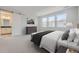 Spacious main bedroom with an en-suite bathroom and ample natural light at 11077 Star Fall St, Littleton, CO 80125