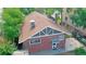 Brick home's rear elevation, showcasing a back patio and part of the yard at 1137 Colorado Blvd, Denver, CO 80206