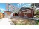 Backyard view showcasing detached storage and paved patio area at 1137 Colorado Blvd, Denver, CO 80206