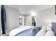 Bedroom with queen bed, sunroom access, and view of backyard at 1137 Colorado Blvd, Denver, CO 80206