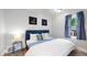 Spacious bedroom with a queen bed and calming decor at 1137 Colorado Blvd, Denver, CO 80206