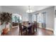 Bright dining room with hardwood floors and a view into the living room at 1137 Colorado Blvd, Denver, CO 80206