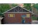 Evening view of brick home's exterior, showcasing backyard at 1137 Colorado Blvd, Denver, CO 80206