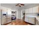 Updated kitchen with stainless steel appliances and white cabinets at 1137 Colorado Blvd, Denver, CO 80206
